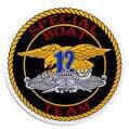 Image of round patch with gold braid design, black background, red words at top saying-Special Boat and at bottom words saying Team. In middle of circle are gold eagle, silver Special Warfare boat and in front of those two items the blue number twelve.