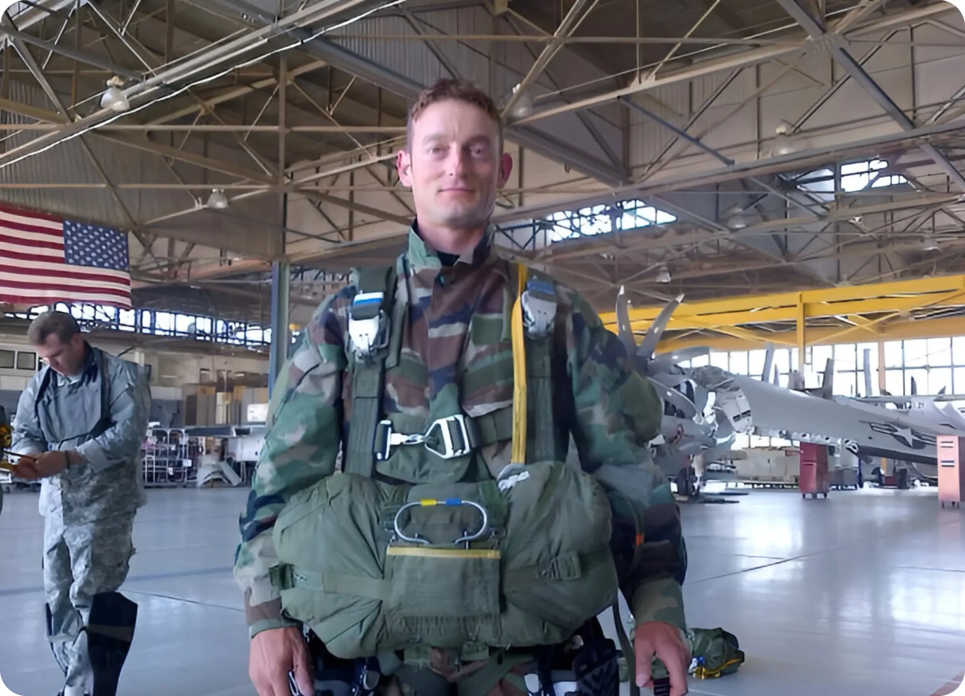 Image of SBC Zach Buob in parachute gear during flight school jump training.